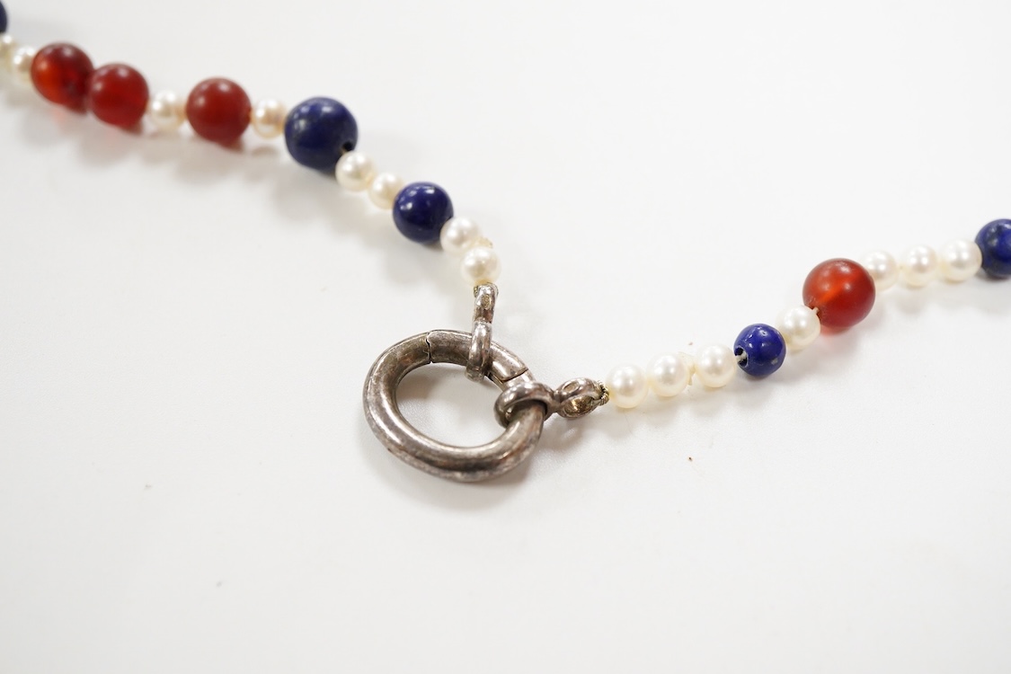 A 20th century Italian lapis lazuli, amber and pearl bead necklace (pearls no tested), with 925 clasp, 124cm.